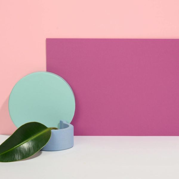 Symmetrical geometric shapes in mint color over black