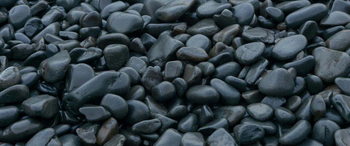 Zen garden elements with smooth stones and mint light